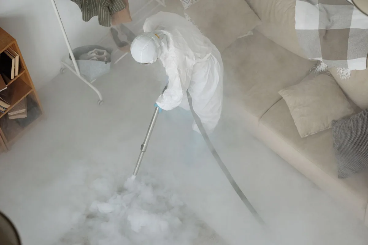 Biohazard cleanup technician in protective equipment, Duluth, GA